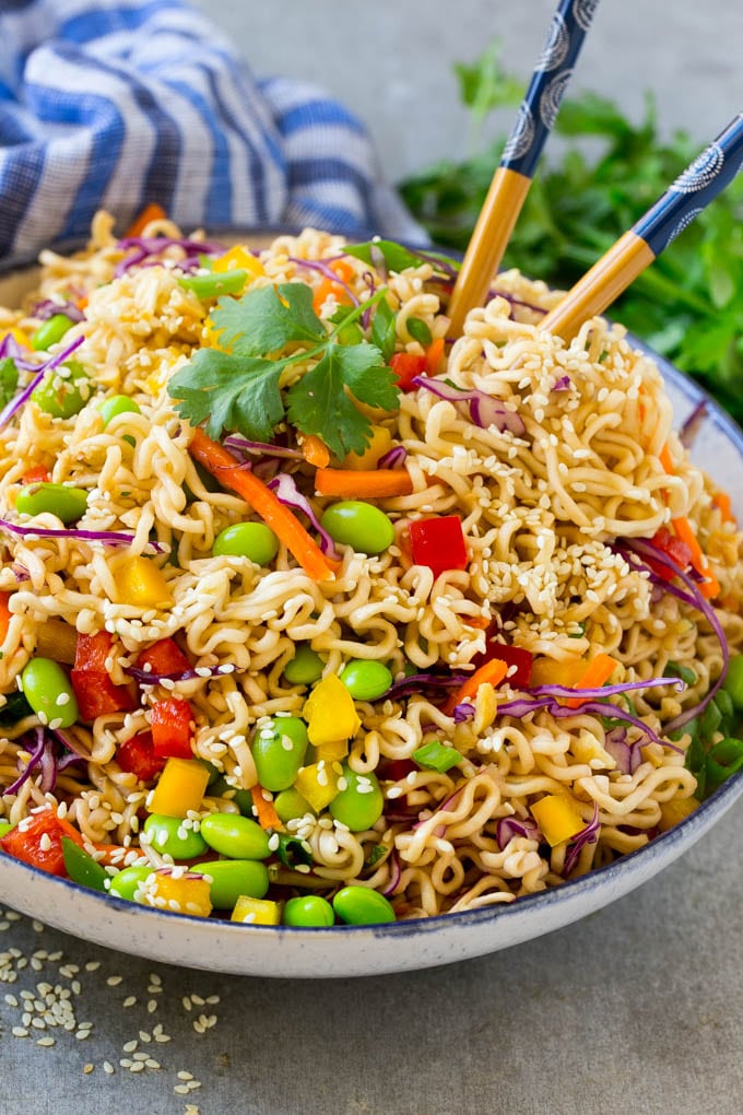 Asian noodle salad with ramen noodles, edamame, bell peppers and carrots in a sesame dressing.