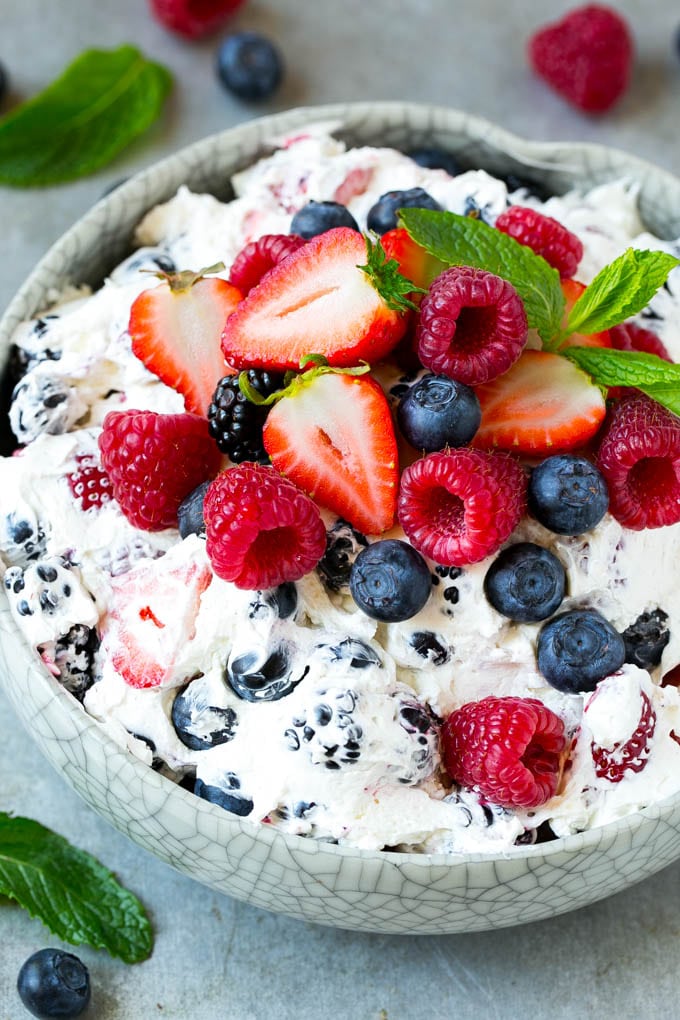 Berry cheesecake salad with fresh mixed berries tossed in a creamy dressing.