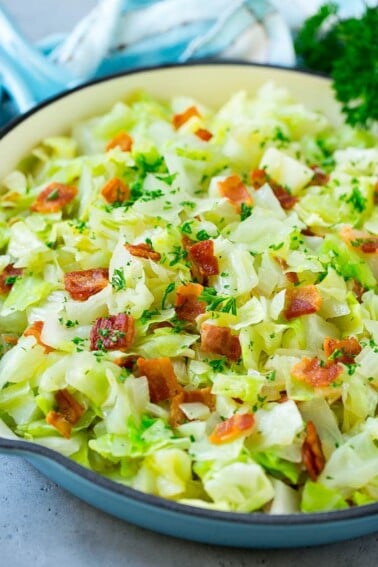 Fried cabbage with bacon, onions and parsley.