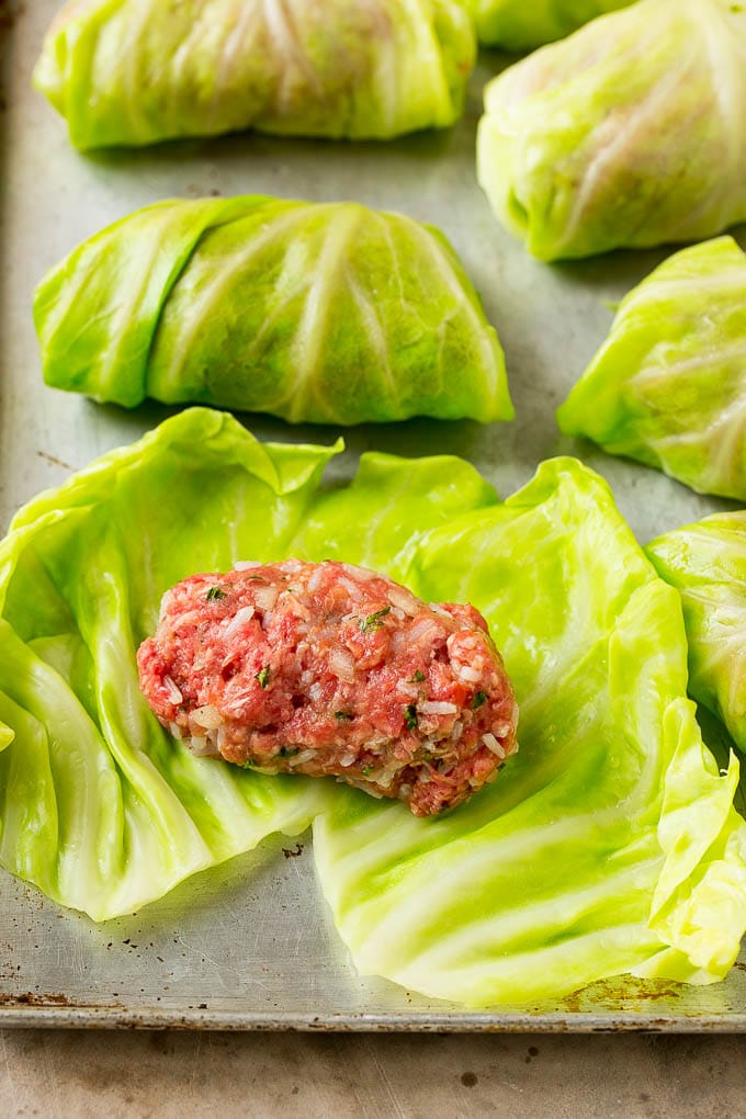 Ground beef and rice on cooked cabbage leaves.