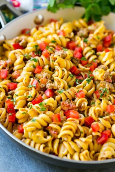 This taco pasta is loaded with ground beef, cheese and tomatoes, then garnished with fresh cilantro.